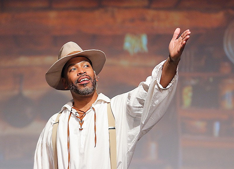 Dingani Beza gestures toward the sound booth Wednesday as the cast rehearses the final curtain call for "The Yearling" at Capital City Productions. Beza plays Ezra "Penny" Baxter in the upcoming production.