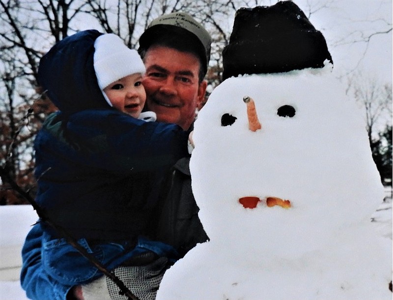 <p>(Courtesy of Dorothy Kleindienst) The columnist’s husband, David, builds a snowman with grandson Ethan Kleindienst.</p>