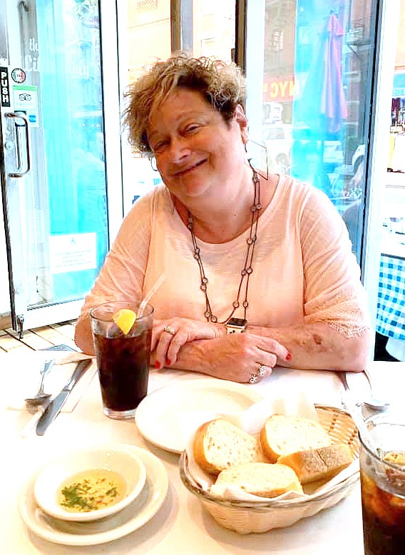 Karen Atkins, Brooklyn Pizza co-owner and 13-year Fulton Sun editor, sits down for a meal at her favorite Italian restaurant in New York City's Little Italy. She and husband Brian Atkins grew up in Brooklyn and were high school sweethearts.