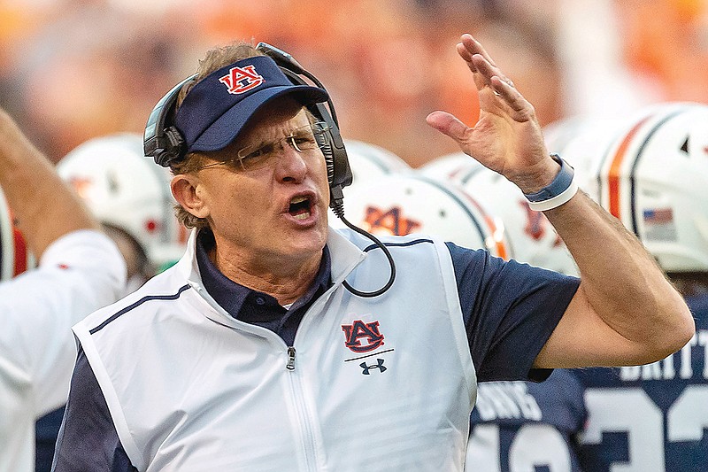 In this Nov. 30, 2019, file photo, Gus Malzahn argues a call during Auburn's game against Alabama in Auburn, Ala.