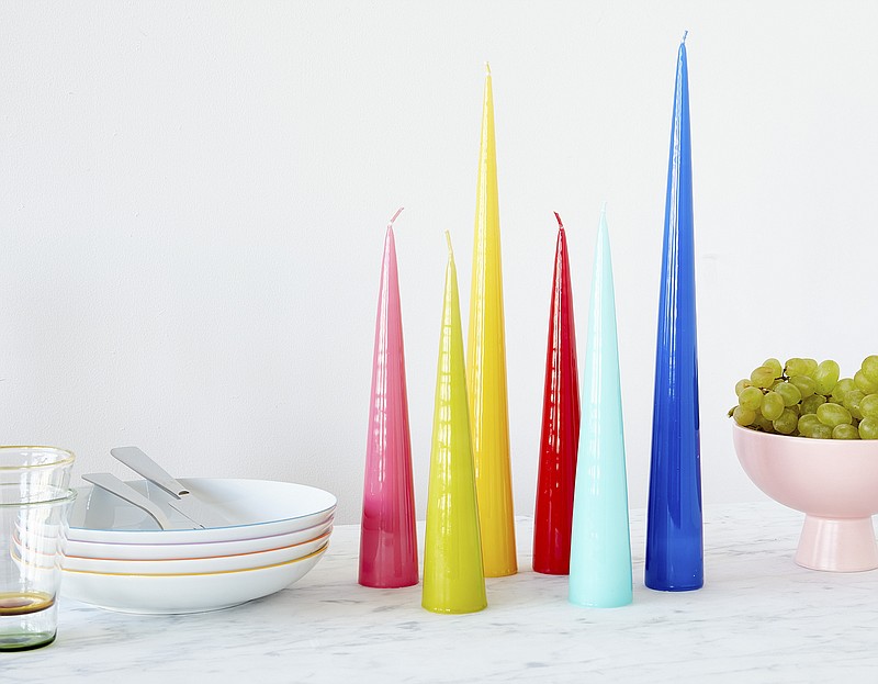 This image provided by MoMA Design Store shows a variety of cone candles. At the Museum of Modern Art's design store, you can find Erik's colorful cone-shaped candles don't need holders; when they get down to about an inch, they just snuff out. (MoMA Design Store via AP)