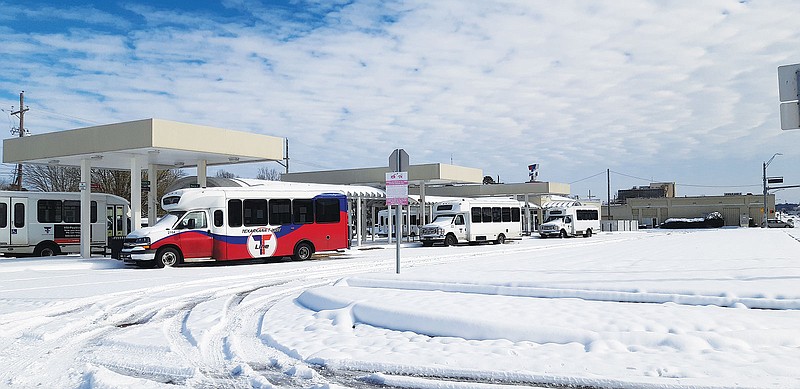 Texarkana's Urban Transit District buses huddle at their terminal on Texas Boulevard. They will not be running routes until Friday, when normal operations resume. Due to snow activity from Monday and what is forecast for today, the T-Line has ceased operations until the end of the week.
