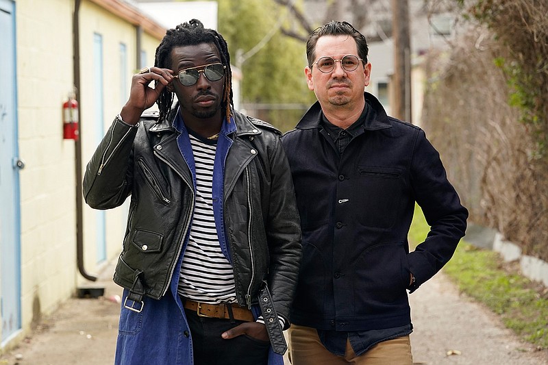 Adrian Quesada, left, and Eric Burton, of Black Pumas, pose for a portrait in Austin, Texas on Feb. 5, 2021. Their deluxe debut album is nominated for album of the year at the 2021 Grammy Awards and their single "Colors" is nominated for record of the year and best American roots performance.  (AP Photo/Eric Gay)