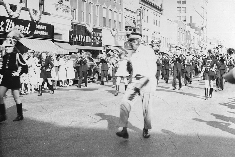 <p>Summers Collection, Missouri State Archives</p><p>John A. Angle, aka “John the Baptist,” proudly leads a parade down High Street. He is followed by a marching band. He marched in Jefferson City parades and played the organ on the street.</p>