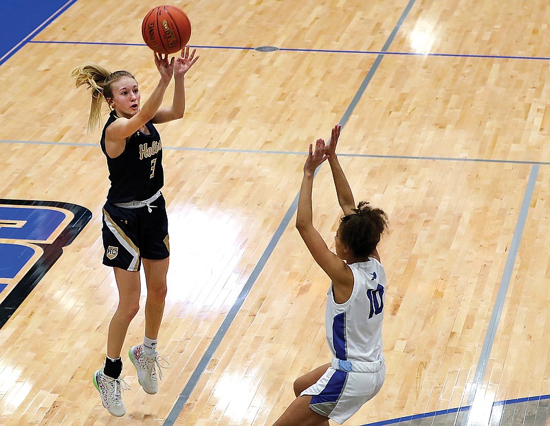 Mikah Edwards of Helias takes a 3-pointer during Thursday's game against Capital City at Capital City High School. 