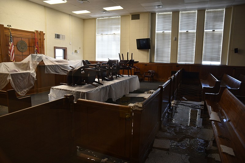 The Miller County Circuit Courtroom has water damage to the ceiling, floor, and walls.

