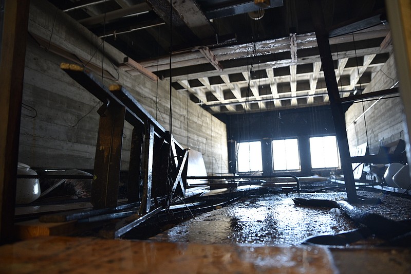 A utility room with leaks and water on the floor is shown on the 3rd floor of the Miller County Courthouse. 
