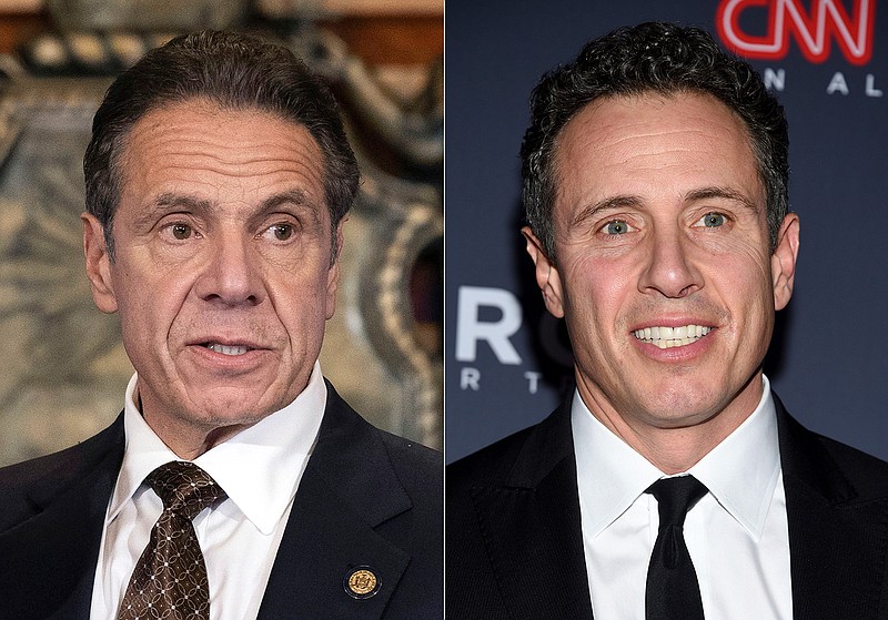 New York Gov. Andrew M. Cuomo, Cuomo appears during a news conference about the COVID-19 vaccine at the State Capitol in Albany, N.Y., on Dec. 3, 2020, left, and CNN anchor Chris Cuomo attends the 12th annual CNN Heroes: An All-Star Tribute at the American Museum of Natural History in New York on Dec. 9, 2018.  CNN said it had reinstated a prohibition on Chris Cuomo interviewing or doing stories about his brother. The policy avoids a conflict of interest or at the very least the appearance of one. (Mike Groll/Office of Governor of Andrew M. Cuomo via AP, left, and Evan Agostini/Invision/AP)