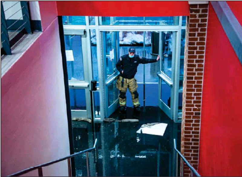 About an inch of water sits in the foyer of the south entrance at Jefferson City High School as a water line broke just a couple of hours before the basketball game Friday evening. All events for the evening were canceled.