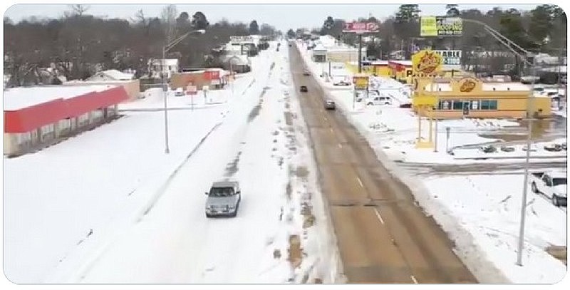 This screen capture show an image of North State Line Avenue in Texarkana, with Texarkana, Arkansas, on the right and Texarkana, Texas, on the left. First captured and published by the Weather Channel, the image went viral Tuesday, with many social media users drawing conclusions from it about the two states' relative preparedness for winter weather.