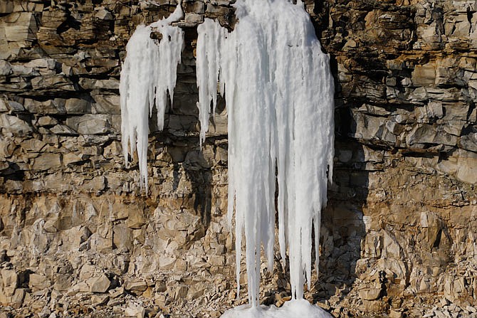 Icicles drip as they melt on a rock wall Saturday along Route B. Ice and snow could be seen melting from various sunny surfaces throughout Saturday as temperatures slowly rose.