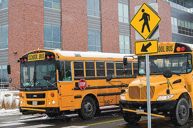 Drivers for the Jefferson City School District wait outside of Capital City High School on Feb. 8, 2021, for students to be dismissed from class. 