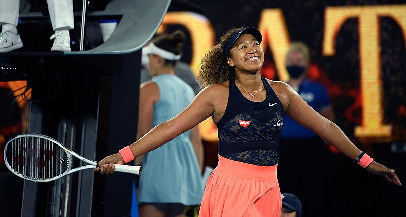 Japan's Naomi Osaka celebrates after defeating United States' Jennifer Brady in the women's singles final at the Australian Open tennis championship in Melbourne, Australia, Saturday, Feb. 20, 2021(AP Photo/Andy Brownbill)