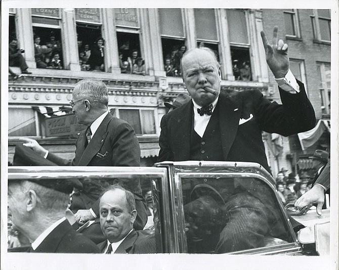 Winston Churchill greets crowds during a parade through Fulton in 1946.