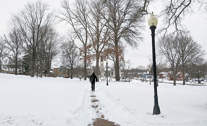 A Westminster College student plods across the snowy landscape Wednesday afternoon. According to the college, applications have nearly doubled despite the ongoing pandemic.