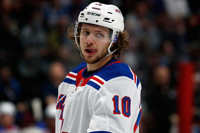 FILE - New York Rangers left wing Artemi Panarin (10) is shown in the second period of an NHL hockey game in Denver, in this Wednesday, March 11, 2020, file photo. New York Rangers star Artemi Panarin is taking a leave of absence after a Russian tabloid printed allegations from a former coach that he attacked an 18-year-old woman in Latvia in 2011. Ex-NHL enforcer Andrei Nazarov is the source for the report after coaching Panarin in the Kontinental Hockey League. Nazarov says he was motivated to speak about it because he disagreed with Panarin's repeated criticism of the Russian government. Panarin denied the allegations in a statement released by the Rangers. (AP Photo/David Zalubowski, File)