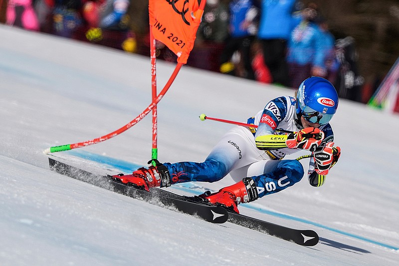 United States' Mikaela Shiffrin speeds down the course during a women's giant slalom, at the alpine ski World Championships, in Cortina d'Ampezzo, Italy, Thursday, Feb. 18, 2021. (AP Photo/Giovanni Auletta)