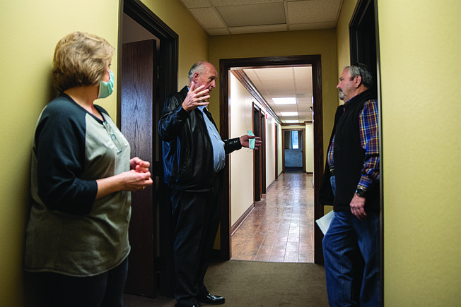 Landmark building owner David Potter, left, guides Miller County officials and staff through what will soon be their temporary home while the damage to the Miller County Courthouse is repaired.