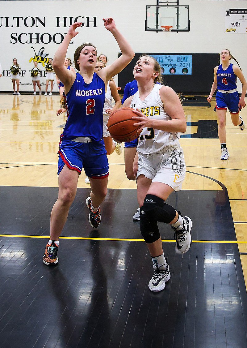 Fulton senior guard Kayanna Gaines drives to the basket against Moberly's Grace Billington during the Lady Hornets' 62-50 NCMC win over the Lady Spartans on Tuesday night at Roger D. Davis Gymnasium.