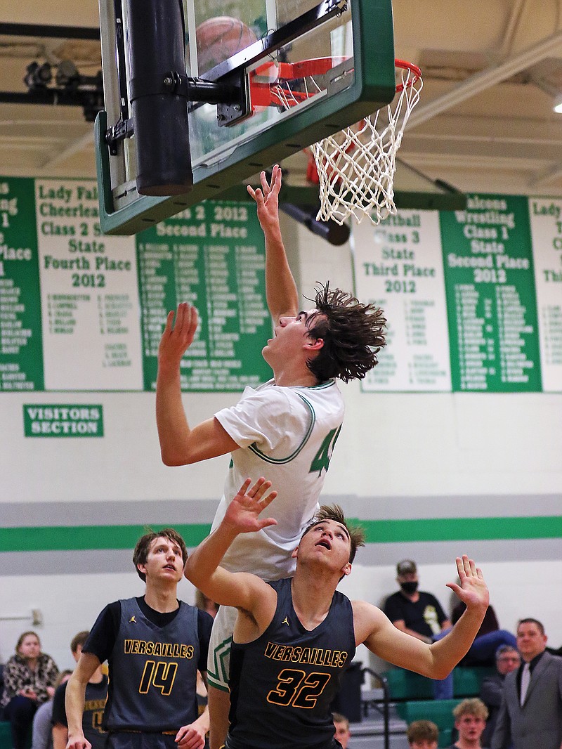 Luke Northweather of Blair Oaks banks in a layup over Eli Gulyayev of Versailles during Tuesday night's game in Wardsville.
