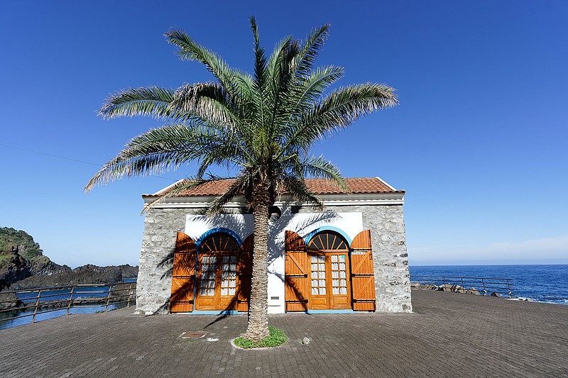 A house, shaded by a palm tree, is seen along the coast in Sexital, Madeira, Portugal. Madeira, an archipelago about 300 miles off the coast of Morocco, is becoming a haven for remote workers from around the world. (Photo by Colin Watts on Unsplash)
