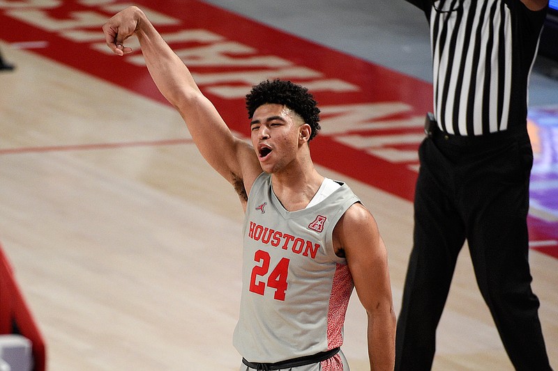 Houston guard Quentin Grimes (24) reacts after making a three point basket during the second half of an NCAA college basketball game against Western Kentucky, Thursday, Feb. 25, 2021, in Houston. (AP Photo/Eric Christian Smith)