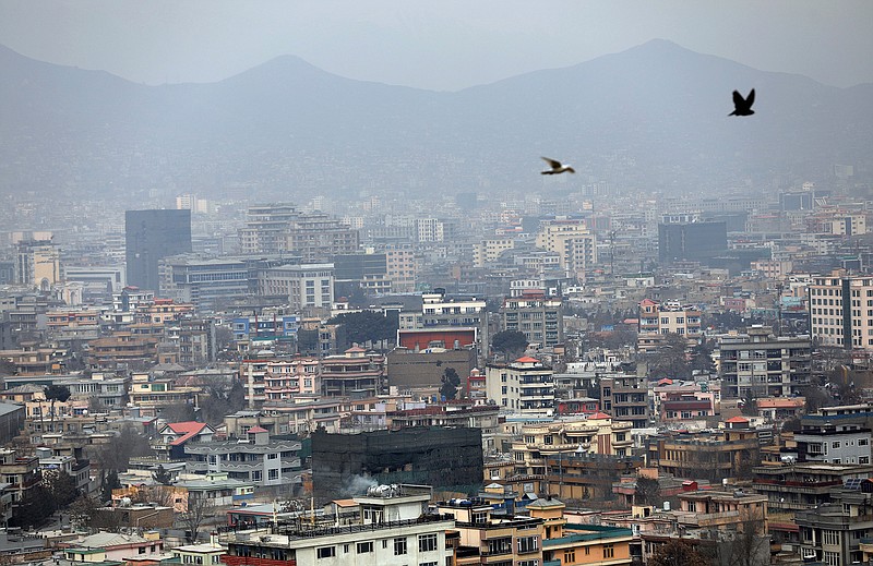 In this Feb. 1, 2021, file photo birds flyover the city of Kabul, Afghanistan. America's longest war is approaching a crossroads. President Joe Biden's choices in Afghanistan boil down to this: withdraw all troops by May and risk a resurgence of extremist dangers, or stay and possibly prolong the war in hopes of compelling the Taliban to make peace. (AP Photo/Rahmat Gul)