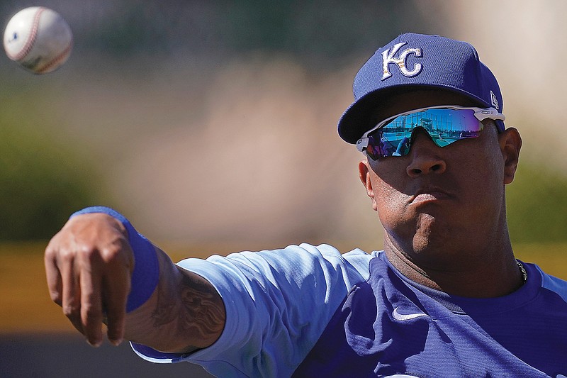 Royals catcher Salvador Perez throws Wednesday during practice in Surprise, Ariz.