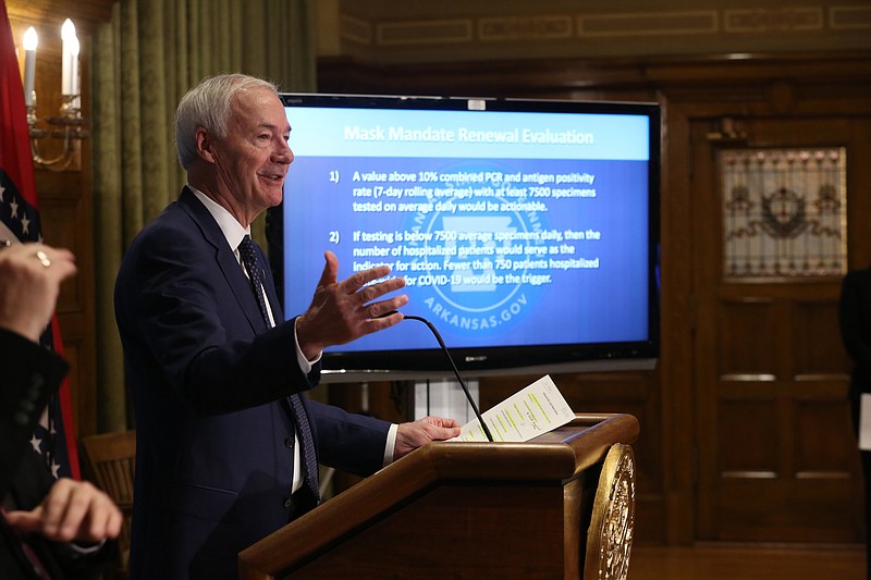 Gov. Asa Hutchinson announces that the state's current mask mandate will become a guideline on March 31 if certain public health goals are met during a press conference on Friday, Feb. 26, 2021, at the state Capitol in Little Rock. (Arkansas Democrat-Gazette/Thomas Metthe)