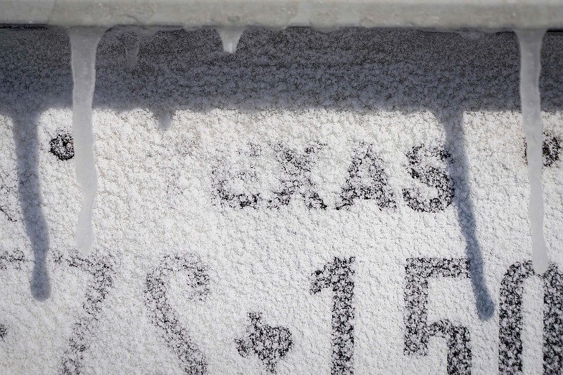 Icicles hang over a Texas license plate on a car after winter storm brought snow and freezing temperatures to North Texas on Monday, Feb. 15, 2021, in Richardson, Texas. (Smiley N. Pool/The Dallas Morning News/TNS)