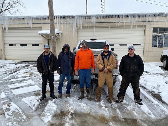 All five of DeKalb's Public Works crew members stand outside their municipal public works station during the recent winter snowstorm, which brought several days of below-freezing temperatures to the Texarkana area last week. The crew members spent 12- to 15-hour days working on municipal water pipe ruptures throughout the city. (Submitted photo)
