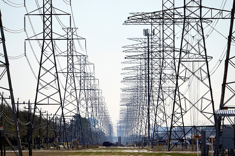 This Tuesday, Feb. 16, 2021 file photo shows power lines in Houston.  (AP Photo/David J. Phillip)