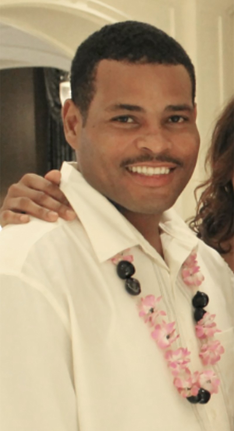 Ronald Greene smiles in an undated photo provided by his family.  A Louisiana State Police trooper has been suspended without pay for kicking and dragging Greene, a handcuffed Black man whose in-custody death remains unexplained and the subject of a federal civil rights investigation. Body camera footage shows Master Trooper Kory York dragging  Greene “on his stomach by the leg shackles” following a violent arrest and high-speed pursuit, according to internal State Police records obtained by The Associated Press.  (Courtesy of the Greene family via AP)