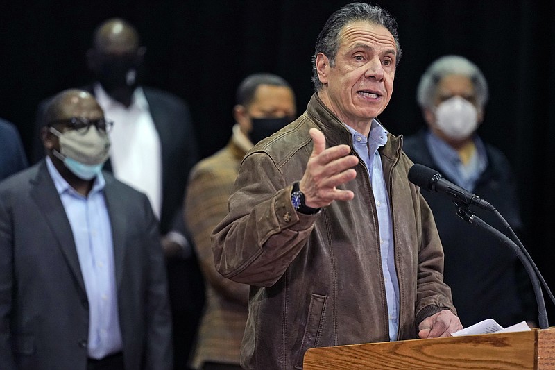 FILE - In this Wednesday, Feb. 24, 2021, file photo, New York Gov. Andrew Cuomo speaks during a press conference before the opening of a mass COVID-19 vaccination site in the Queens borough of New York.  A former aide’s allegations that Gov. Cuomo subjected her to an unwanted kiss during years of sexual harassment have spurred calls for an investigation — and questions about who might meaningfully conduct one.  (AP Photo/Seth Wenig, Pool, File)