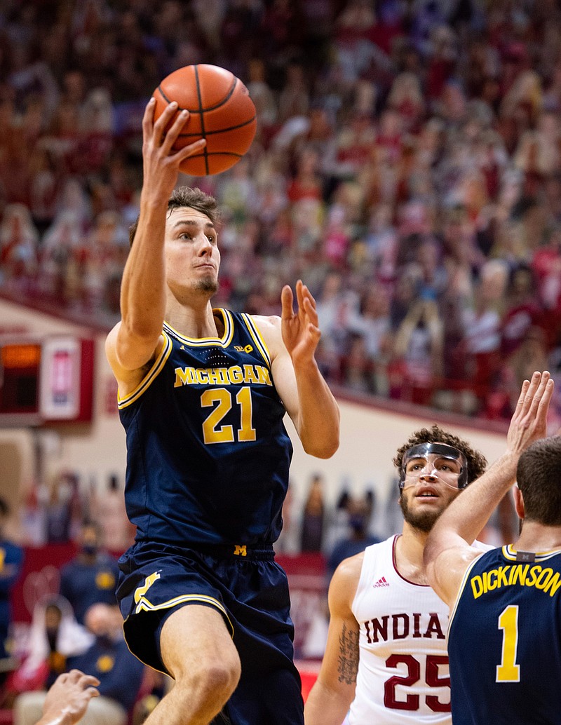 Michigan guard Franz Wagner (21) drives to the basket during the first half of an NCAA college basketball game against Indiana, Saturday, Feb. 27, 2021, in Bloomington, Ind. (AP Photo/Doug McSchooler)