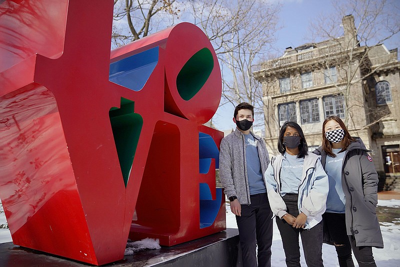 From left, University of Pennsylvania junior Joey Lohmann and senior Preethi Kumaran, two of the founders of Lockdown Letters, and senior Jenny Chang, a program ambassador, on the Penn campus in West Philadelphia on Feruary 20, 2021. (Tim Tai/The Philadelphia Inquirer/TNS)