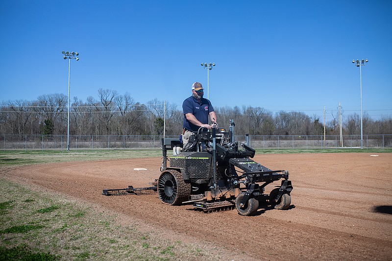 Adam Dalby, sports manager at Texarkana Arkansas Public Works Department, grades the baseball field at Ermer Dansby Pondexter Sports Complex with the city's new state-of-the-art Abiforce z23.