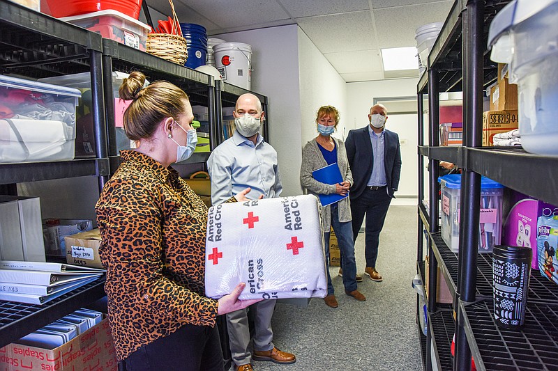 Julie Smith/News Tribune
Red Cross of Central and Northern Missouri Executive Director Abigail Anderson, near, details for members of the Fund Allocation Committee of the United Way of Central Missouri how funds from the UW are distributed and spent. During a tour Wednesday morning the United Way volunteers saw the storage area, phone bank room and blood collection center. In addition, the allocation team was shown first hand the items that personnel may stop in to get when responding to an emergency. Allocation team members are, Jeremy Morris, second from left, Gaye Suggett and Peter Grefrath.