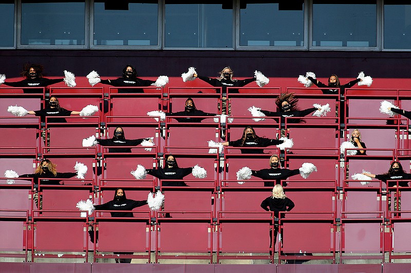 Washington Football Team cheerleaders perform before an NFL football game against the New York Giants in Landover, Md., in this Sunday, Nov. 8, 2020, file photo. The Washington Football Team will not have cheerleaders for the 2021 season as part of an organizational rebranding. Washington hired Petra Pope, who managed the "Laker Girls" and brings three decades of NBA experience as an adviser to take on the task of reinventing the group.(AP Photo/Daniel Kucin Jr., File)