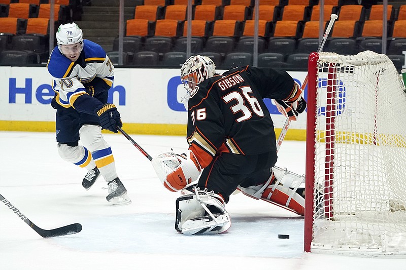 Blues center Oskar Sundqvist (left) scores past  Ducks goaltender John Gibson during the first period of Wednesday night's game in Anaheim, Calif.