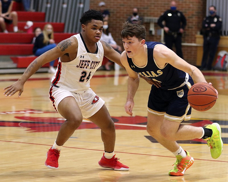 Malcom Davis of Helias dribbles around Kevion Pendelton of the Jays during a game earlier this season at Fleming Fieldhouse.