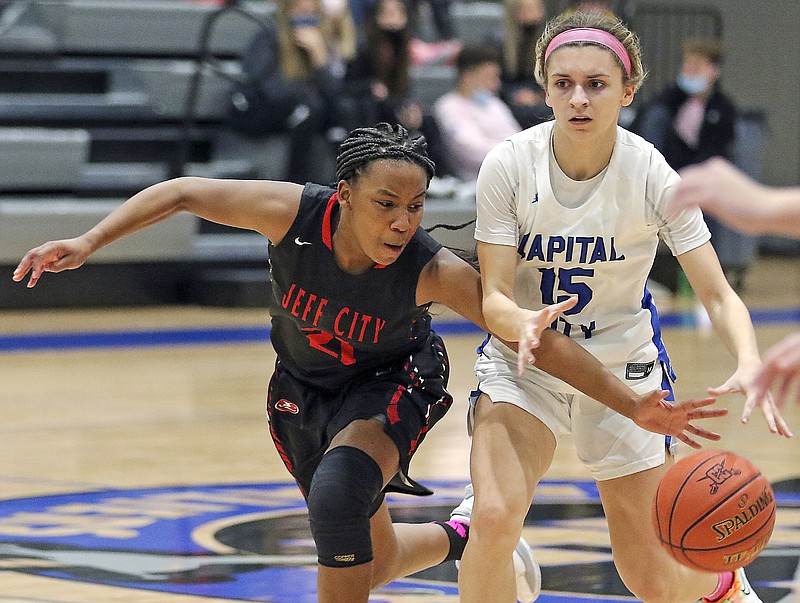 Jefferson City's Emmarie Graham swats the ball away from Capital City's Brooklynn Greene to force a turnover during a game earlier this season at Capital City High School.