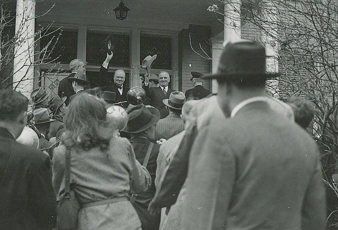 Winston Churchill and Harry Truman stop on the porch of Westminster College President Franc McCluer's house.