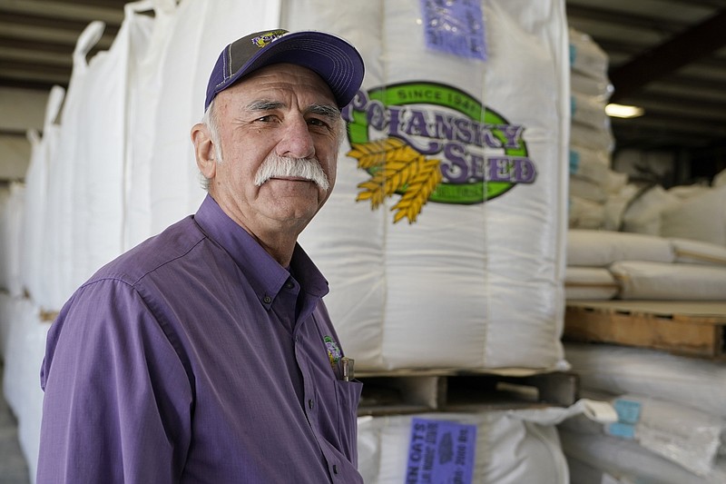 Adrian Polansky, a farmer and former executive director of the USDA’s Farm Service Agency office in Kansas during the Obama administration,  stops for a photo while touring his seed processing plant near Belleville, Kan., Friday, March 5, 2021.  More than a year after two U.S. Department of Agriculture research agencies were moved from the nation’s capital to Kansas City, they remain critically understaffed and some farmers are less confident in the work they produce. (AP Photo/Orlin Wagner)