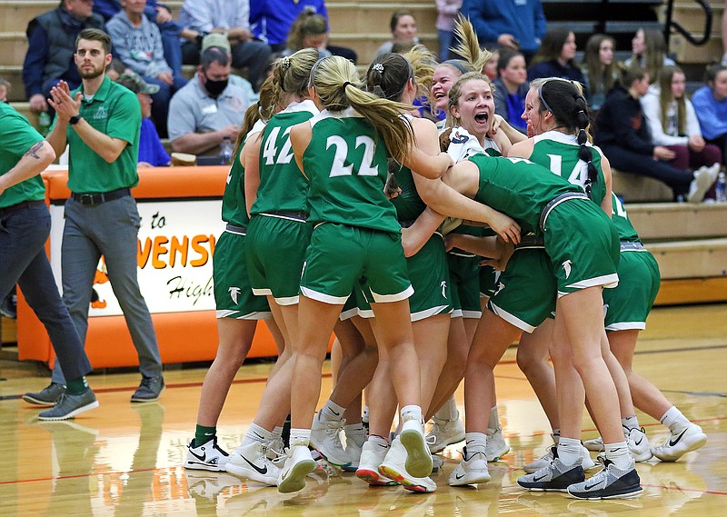 The Blair Oaks Lady Falcons celebrate Friday night after defeating Fatima in the Class 4 District 9 Tournament title game in Owensville.