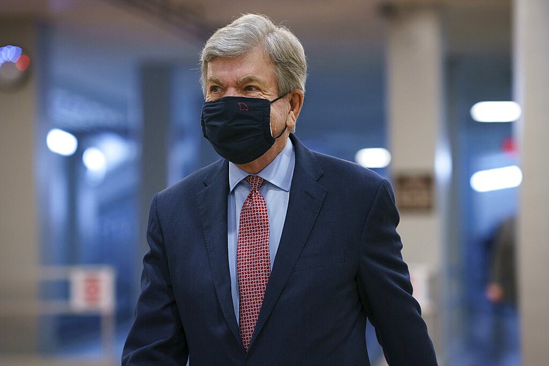 Sen. Roy Blunt, R-Mo., heads to the chamber as the Senate holds a voting marathon on the Democrats' $1.9 trillion COVID-19 relief bill that's expected to end with the chamber's approval of the measure, at the Capitol in Washington, Friday, March 5, 2021. (AP Photo/J. Scott Applewhite)