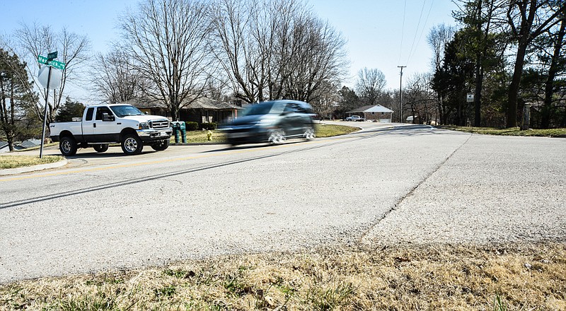 Traffic passes Tuesday, March 9, 2021, through an intersection at Henwick Lane and Sharon Drive in Cole County.