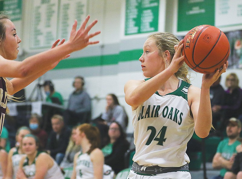 Grace Boessen of Blair Oaks protects the ball while looking for a teammate during Wednesday night's Class 4 sectional game against Eldon in Wardsville.