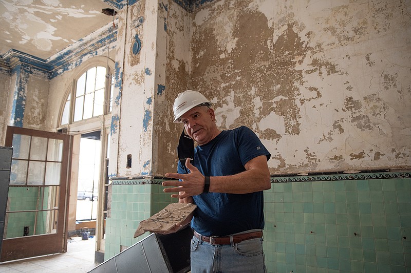 Tim Minson, Cohen-Esrey Development Group project manager, explains how the repairs to the Hotel Grim's intricate ceiling molding will be made with plaster molds.