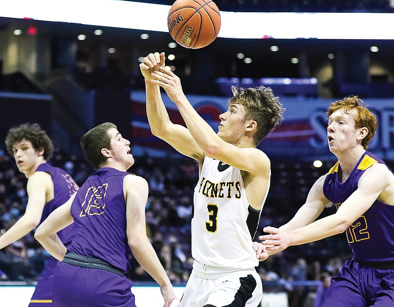 St. Elizabeth's Clayton Holtmeyer tries to gain control of the ball between Mound City's Tony Osburn (left) and Gage Salsbury during Friday's Class 1 semifinal at JQH Arena in Springfield.